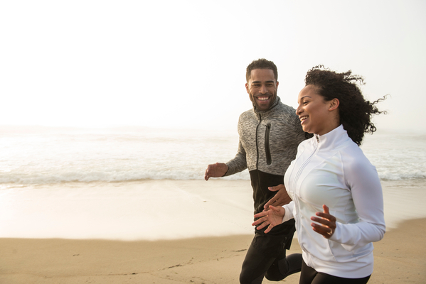 Couple running on the beach