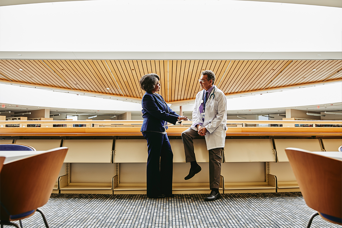 Two providers having a chat in a common area. 